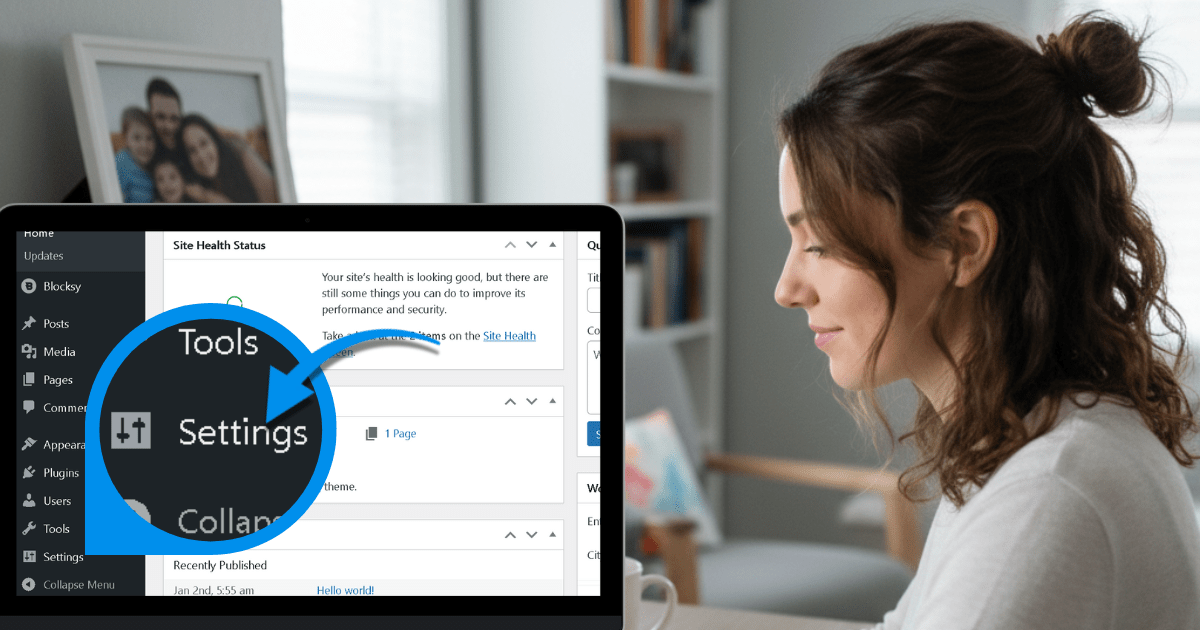 Woman uses a laptop while focusing on WordPress settings with a magnified view on the screen.